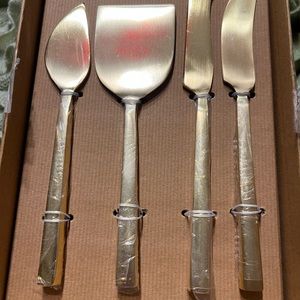 SOLDPottery Barn. New set of 4 gold Luna cheese knives.SOLD
